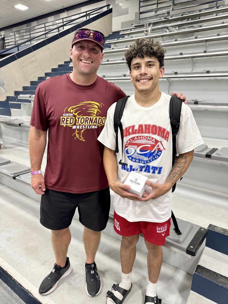 All-State wrestler and his coach in the stands