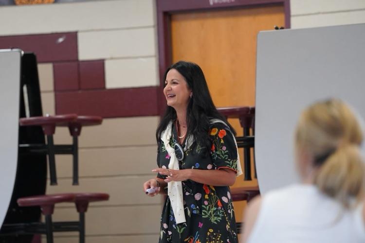 guest speaker smiling at teachers