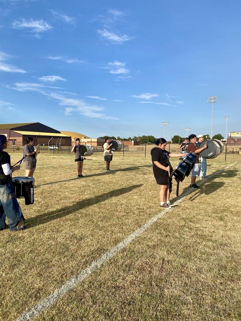 Percussion lined up on the practice field