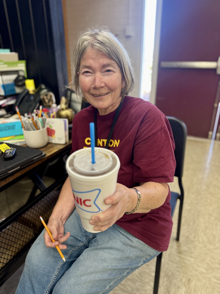 CHS teacher smiling and holding a Sonic drink
