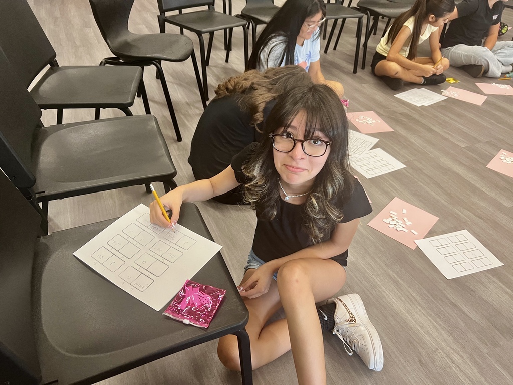 Student writing rhythms in music class