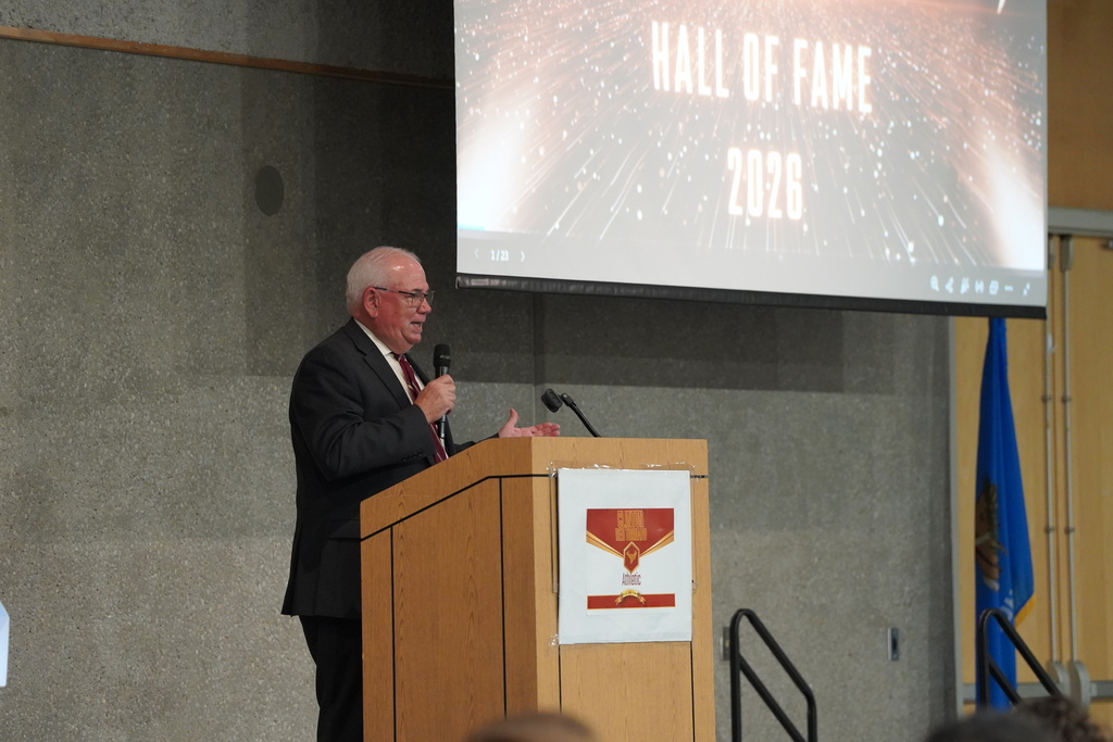 Master of Ceremonies Dennis Smith on stage