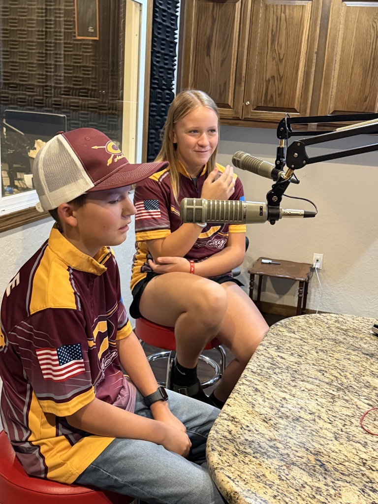 2 archery students talking on the radio