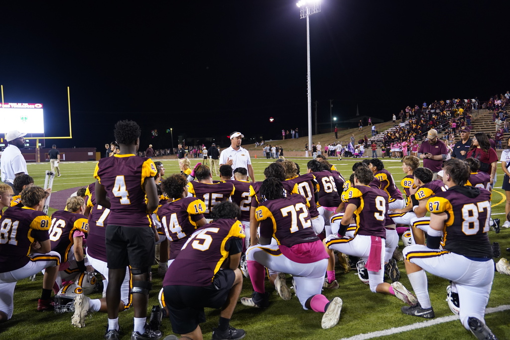 Football team huddle after the game
