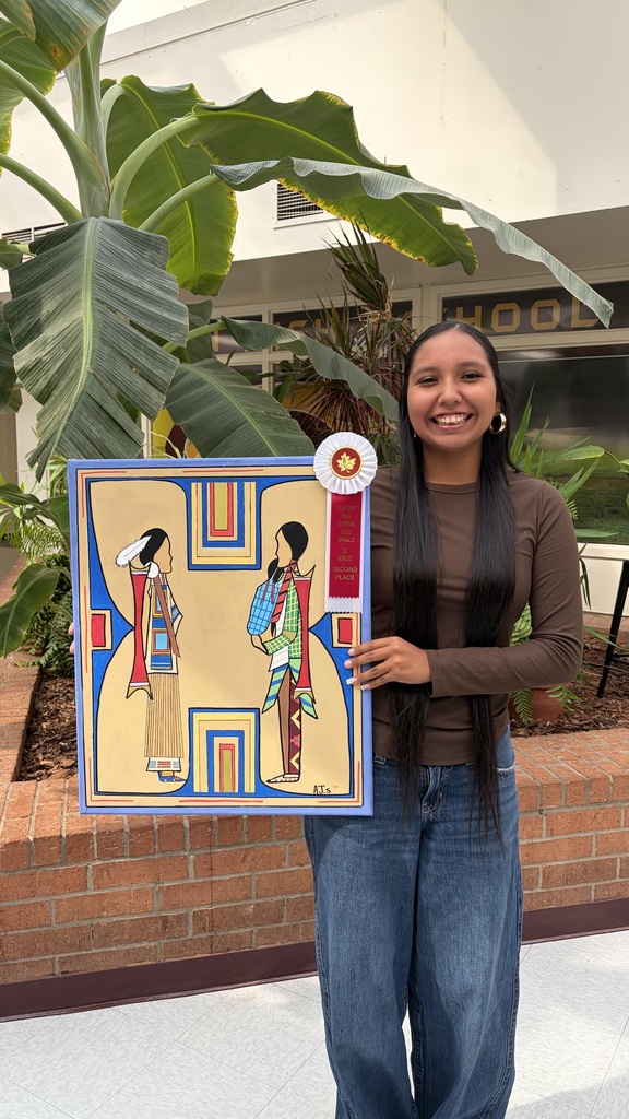 Student holding her Oil/Acrylics 2nd place artwork