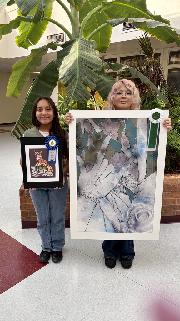 Students holding their faux stained glass" fox and Graphics 1 projects