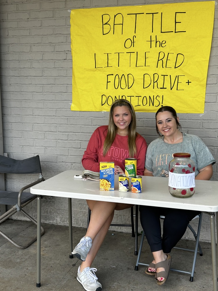 students taking donations at cash saver