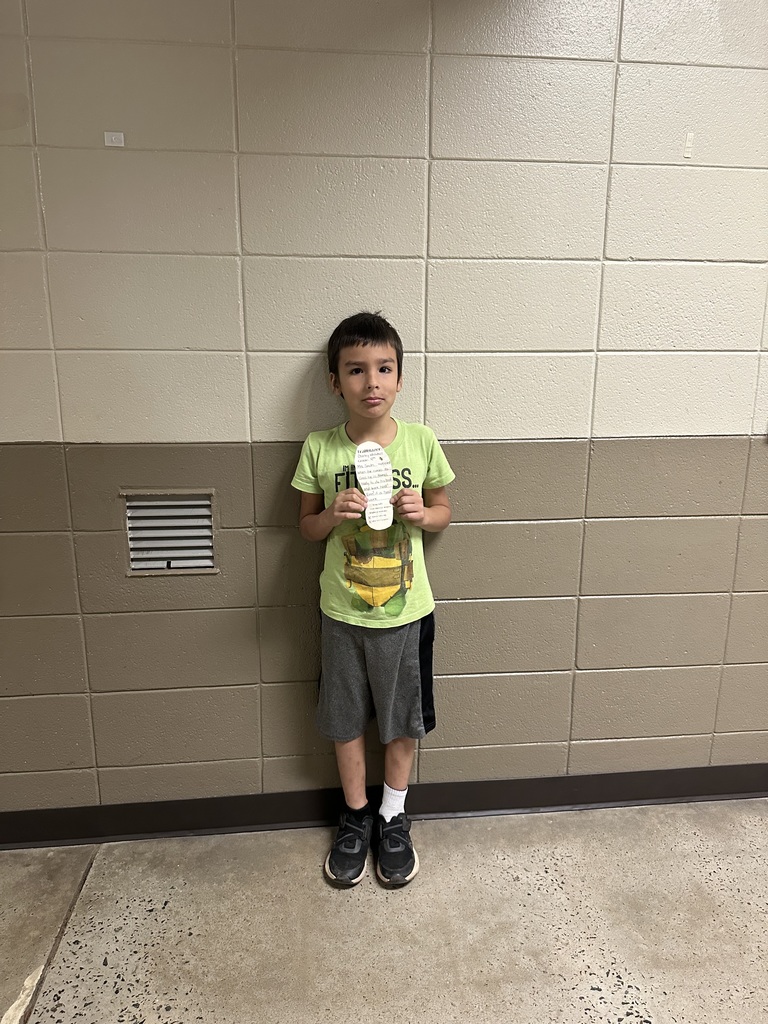 student in a green shirt