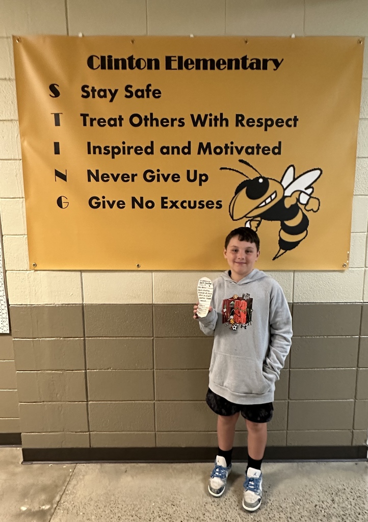 Little boy holding a foot cut out