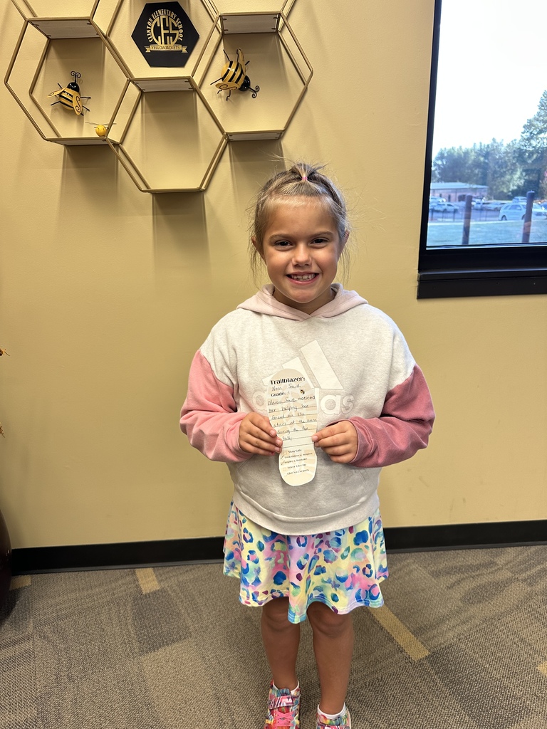 little girl holding a cutout foot