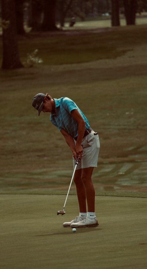 boy playing golf