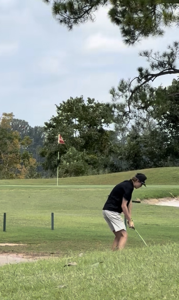 boy playing golf