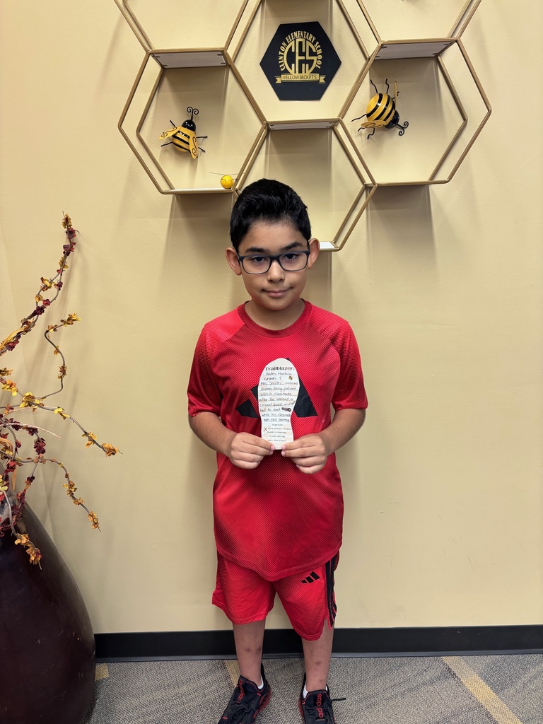boy holding a paper foot