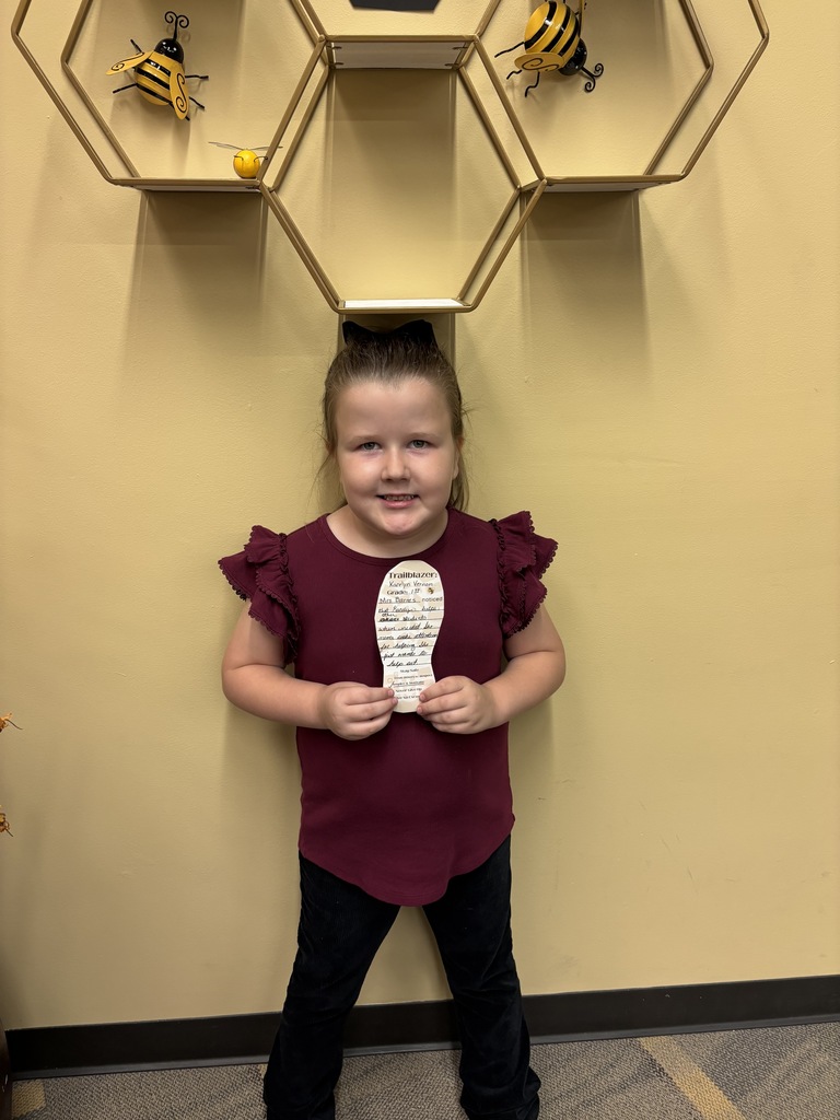little girl holding a cutout foot