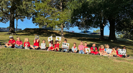 group of students wearing red