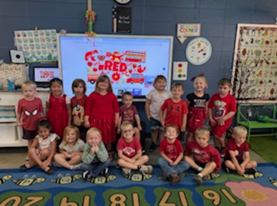 group of students wearing red