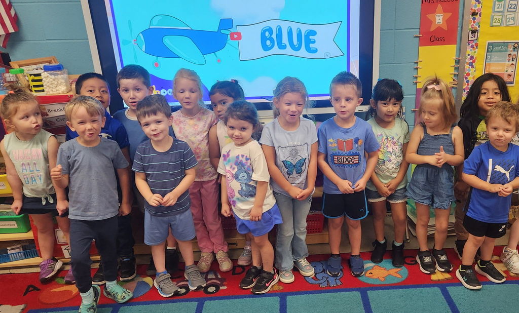 a group of kids wearing blue