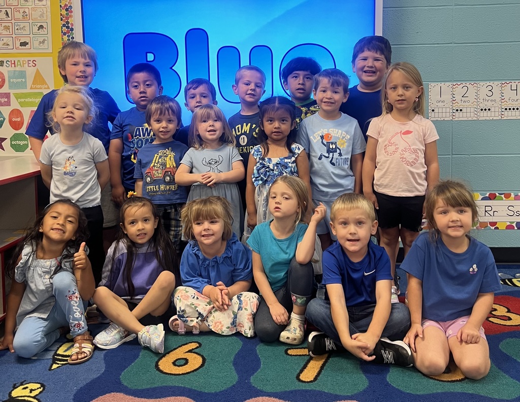 a group of kids wearing blue