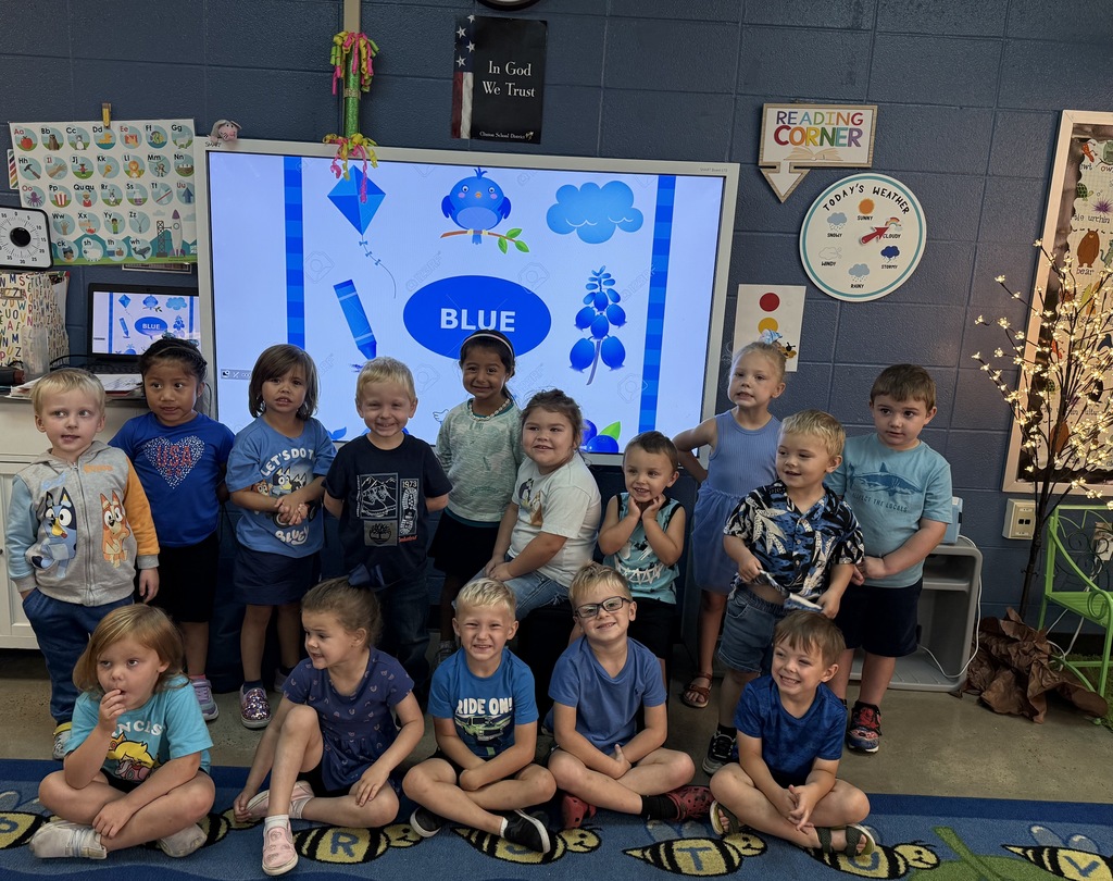 a group of kids wearing blue