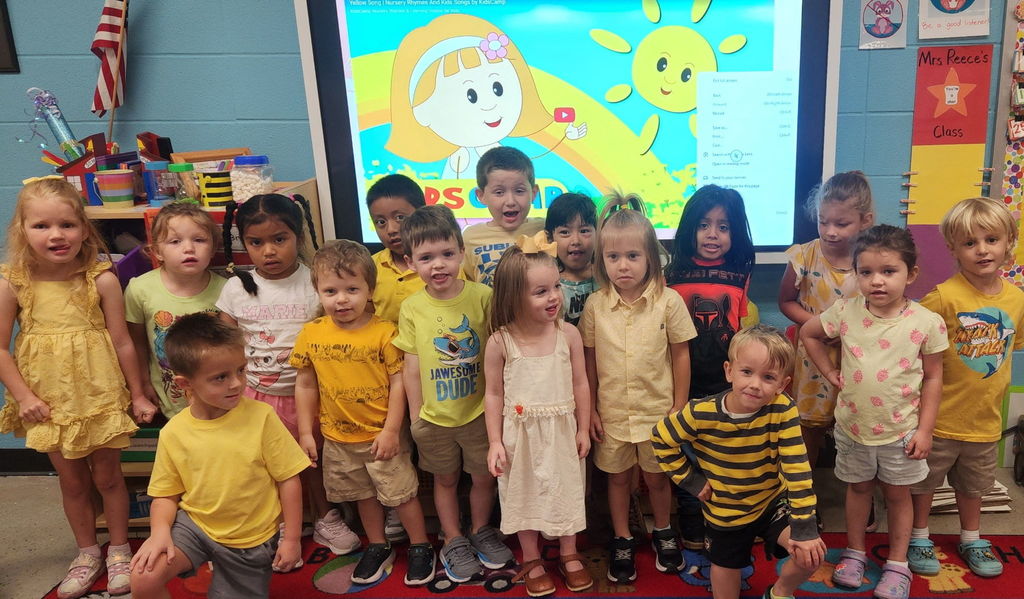 group of students wearing yellow