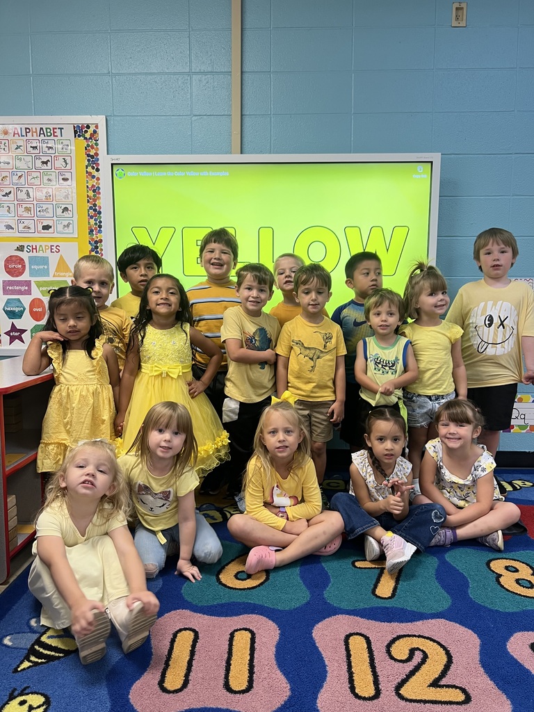 group of students wearing yellow
