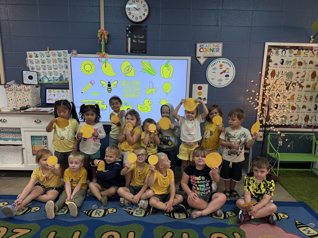 group of students wearing yellow