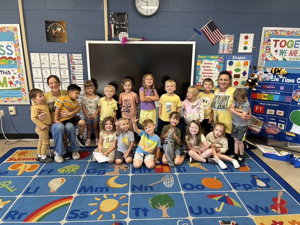 group of students wearing yellow