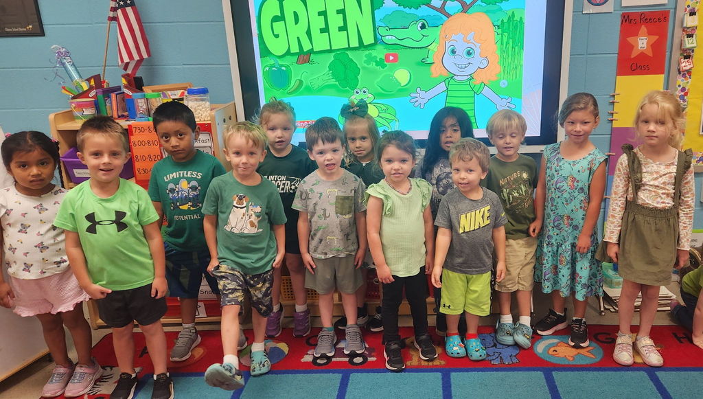 group of students wearing green