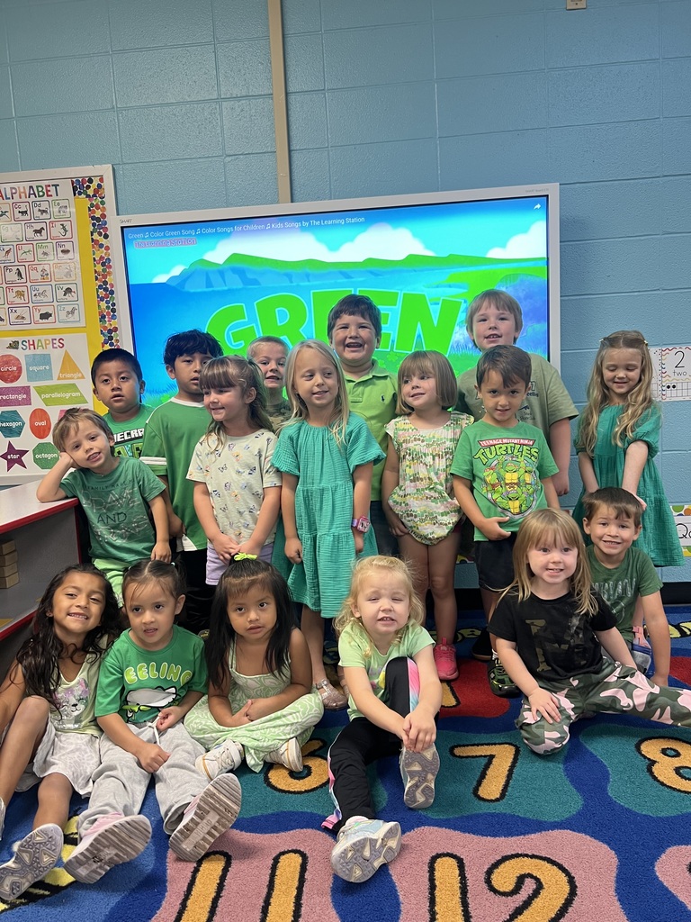 group of students wearing green