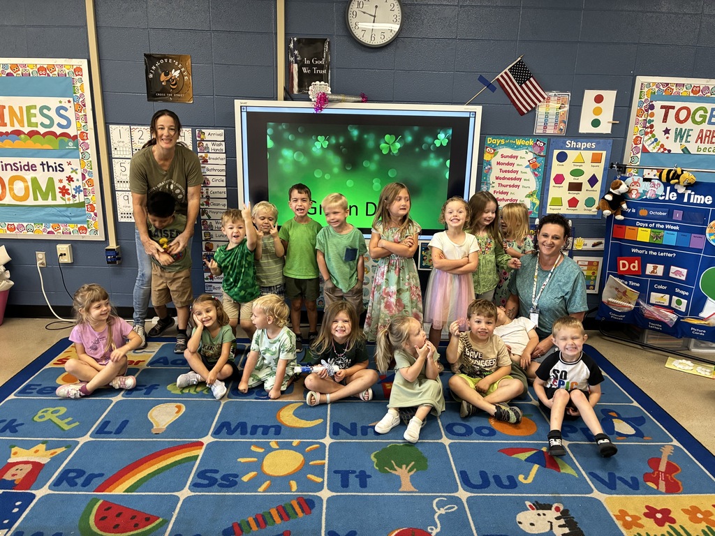 group of students wearing green
