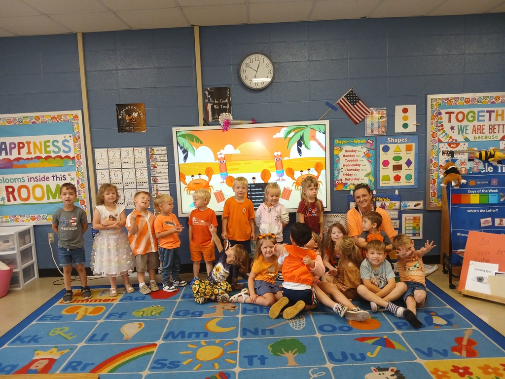 group of kids wearing orange