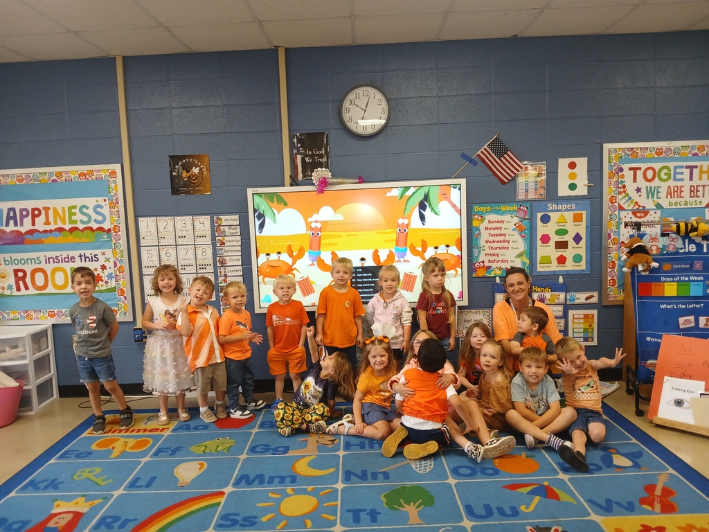group of kids wearing orange