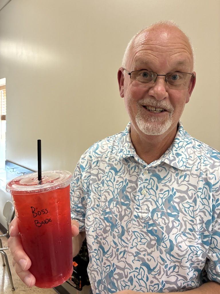 old man with a red tea