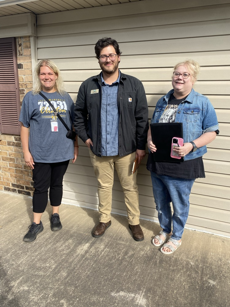3 adults standing