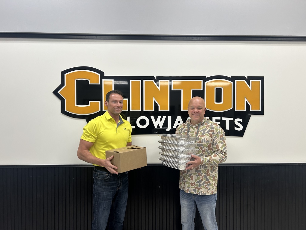2 men holding pans