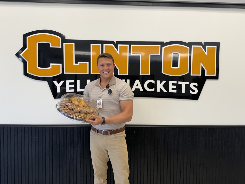 man holding a tray of cookies