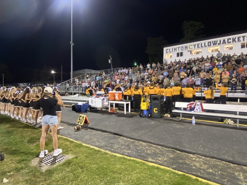 marching band playing in front of a crowd