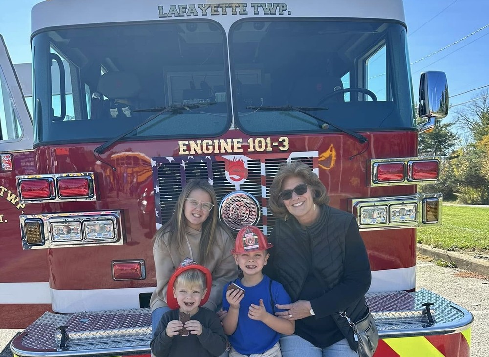 Family and a fire truck