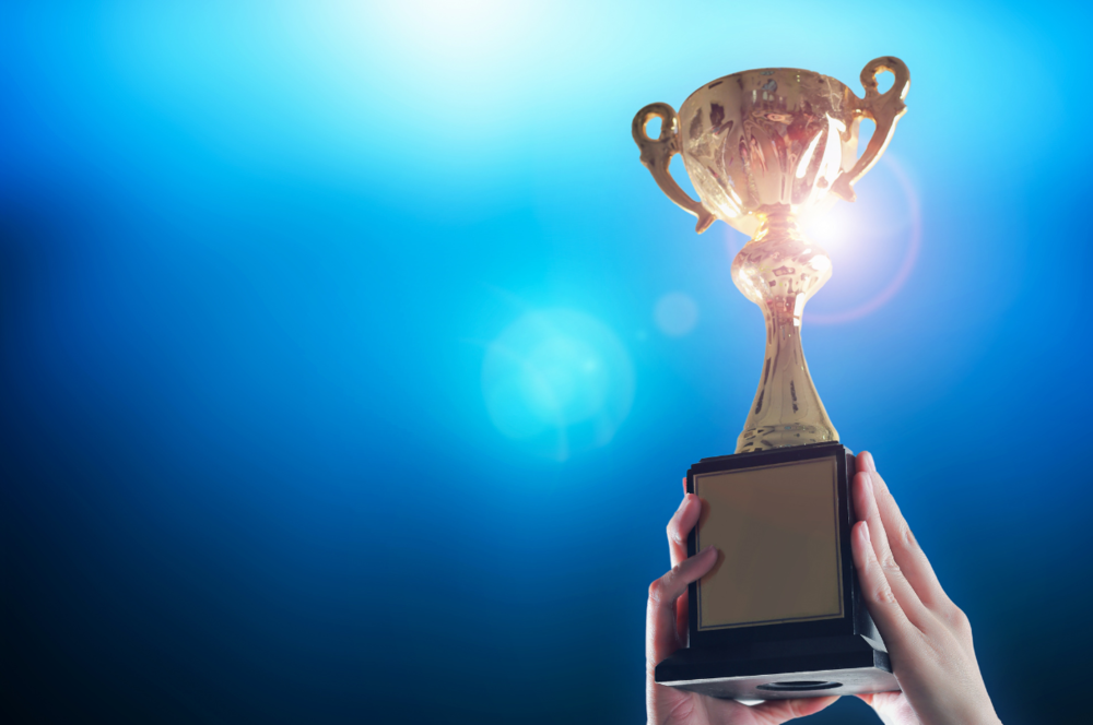 Hands holding trophy