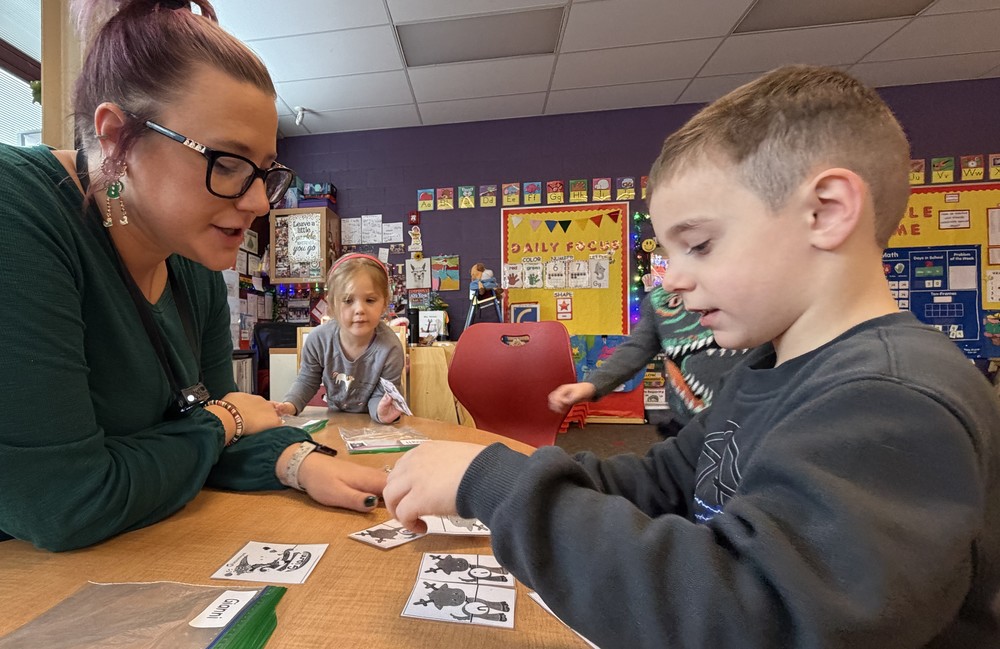 Preschool teacher with student