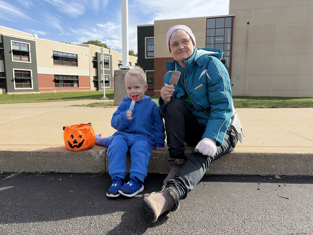 Boy and grandmother eating frozen treats