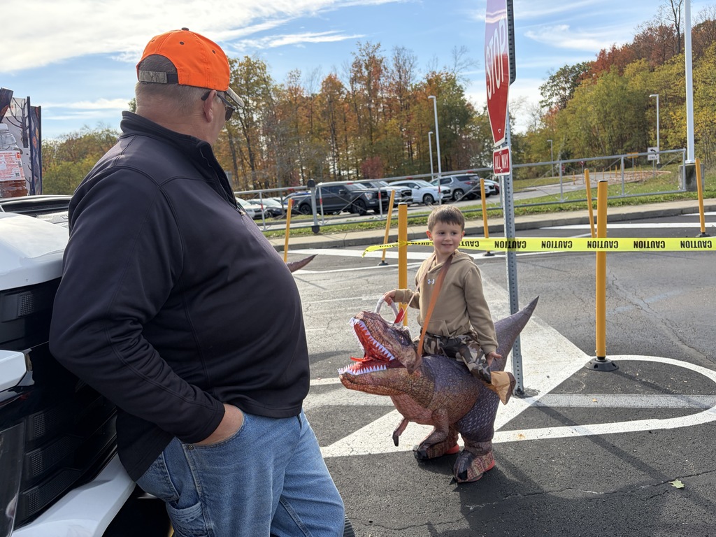 Boy in dinosaur costume