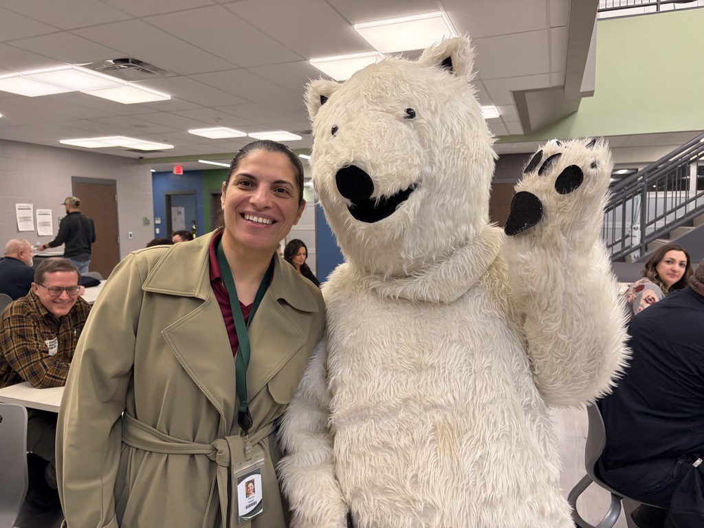 Staff member with Chippy the polar bear