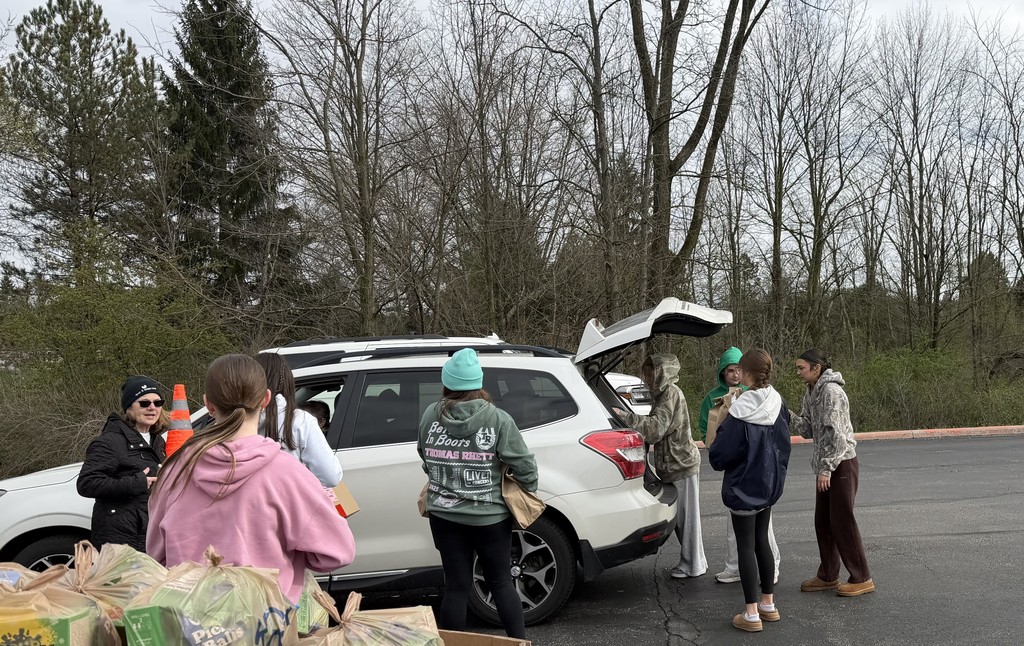 Loading Bags of Kindness into car