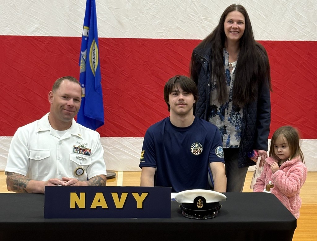 Jason Bagley with family and recruiter