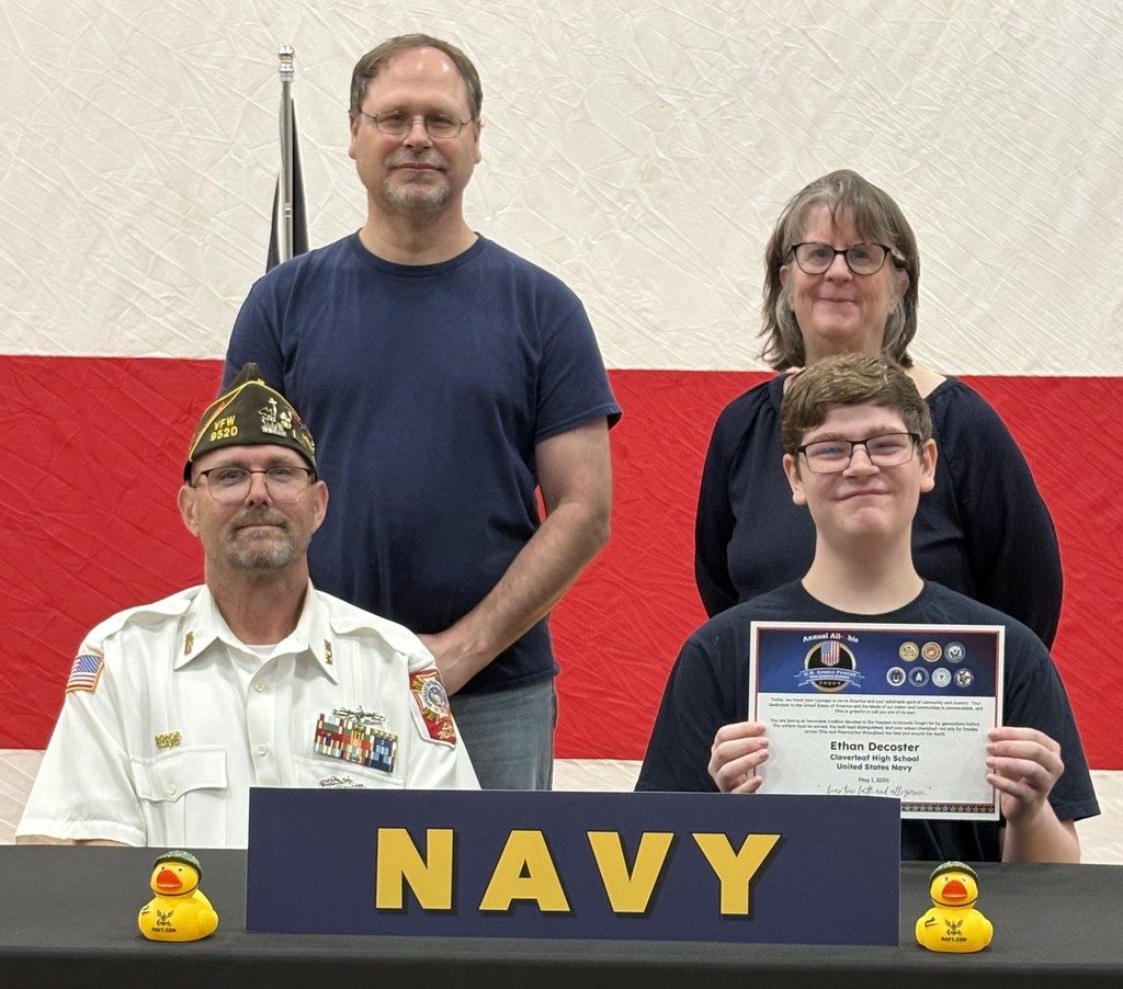 Ethan Decoster with family and recruiter