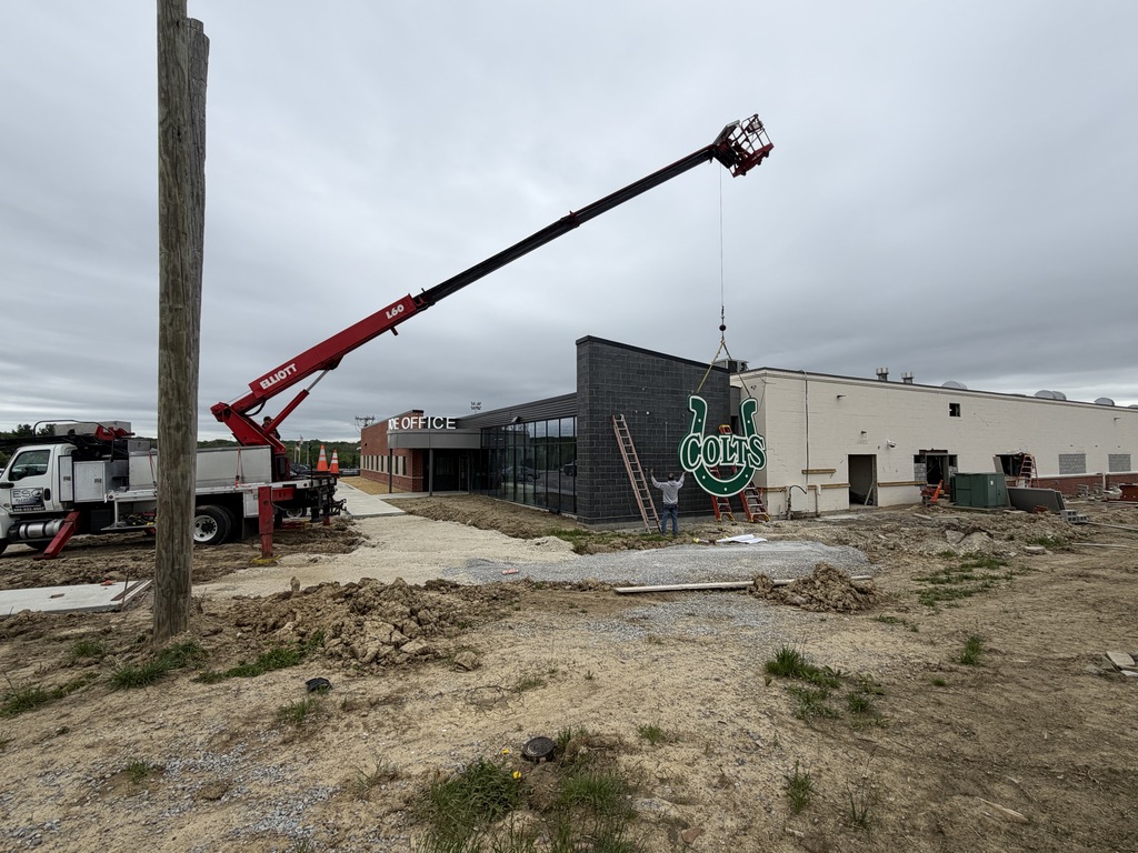 Crane moving Colts sign into position