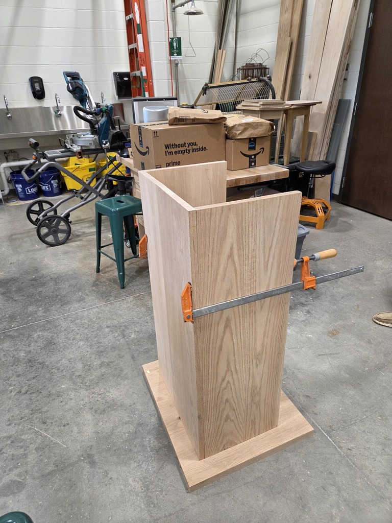 Podium clamped during assembly