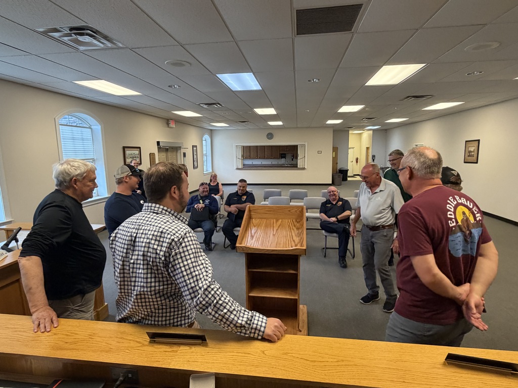 Meeting attendees admiring new podium