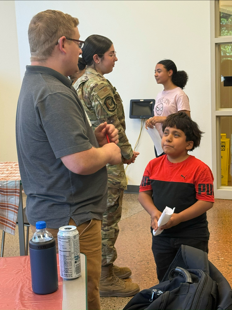 Gattis students talk with community volunteers during round one of the Amazing Shake